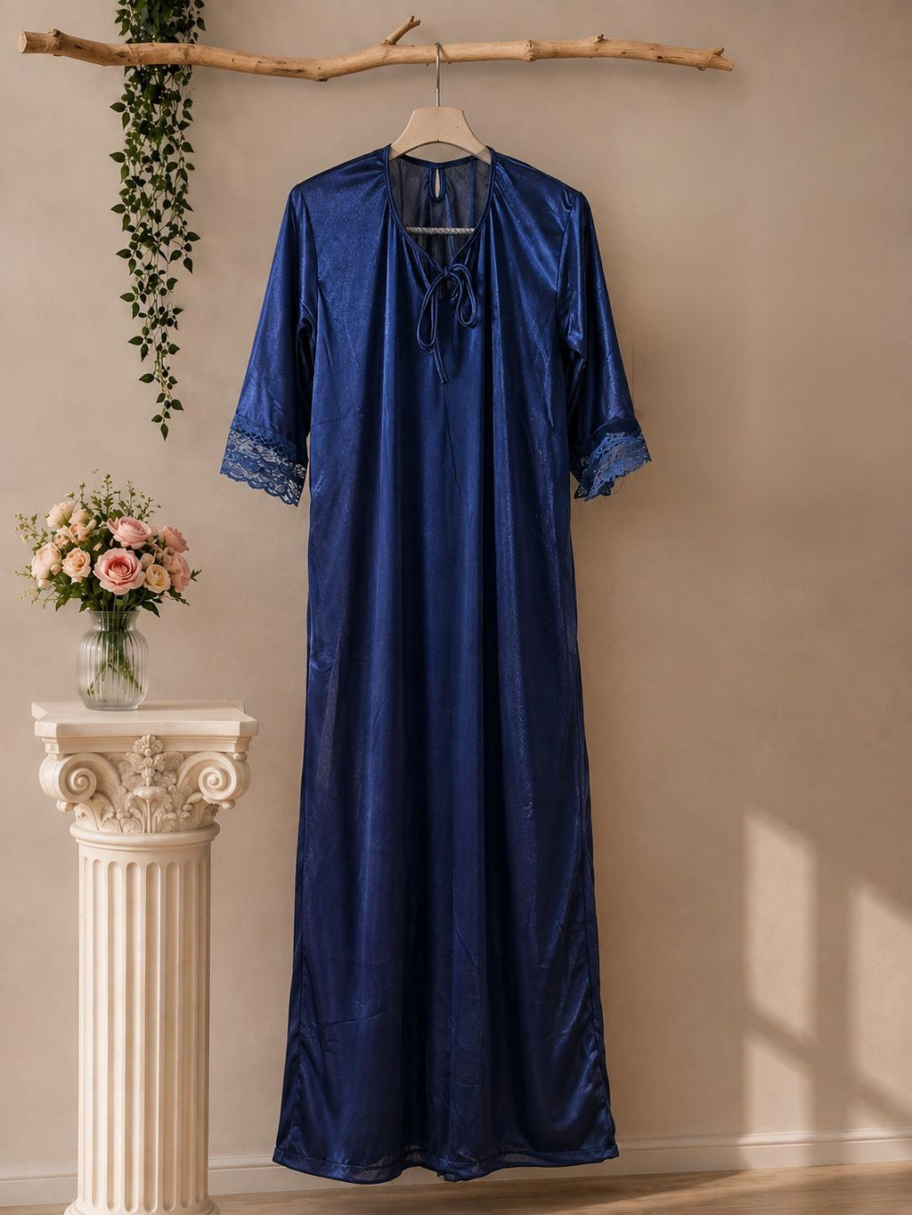 Navy blue satin bridal robe displayed on hanger